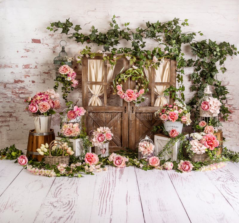 Pink l spring sett up with colourful flowers pink , vintage wood parquet. Ideal for family, Easter or aniversary photo shoots. Pink l spring sett up with colourful flowers pink , vintage wood parquet. Ideal for family, Easter or aniversary photo shoots