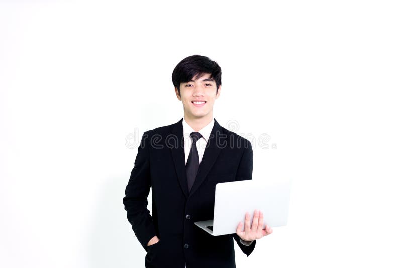 L'uomo bello di affari asiatici ha computer portatile della tenuta per woking con la h fotografia stock libera da diritti L'uomo bello di affari asiatici ha computer portatile della tenuta per woking con la h fotografia stock libera da diritti