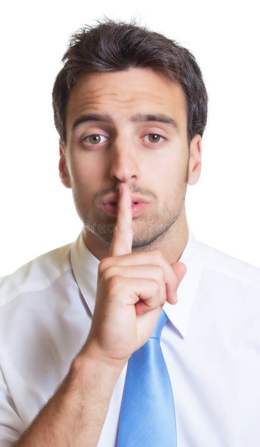 L'uomo d'affari con la cravatta blu ha bisogno del silenzio fotografia stock L'uomo d'affari con la cravatta blu ha bisogno del silenzio fotografia stock