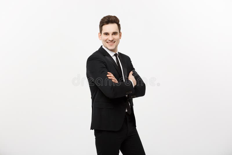 L'uomo d'affari felice ha isolato - il riuscito uomo bello che sta con le armi attraversate isolato sopra fondo bianco immagini stock libere da diritti L'uomo d'affari felice ha isolato - il riuscito uomo bello che sta con le armi attraversate isolato sopra fondo bianco immagini stock libere da diritti