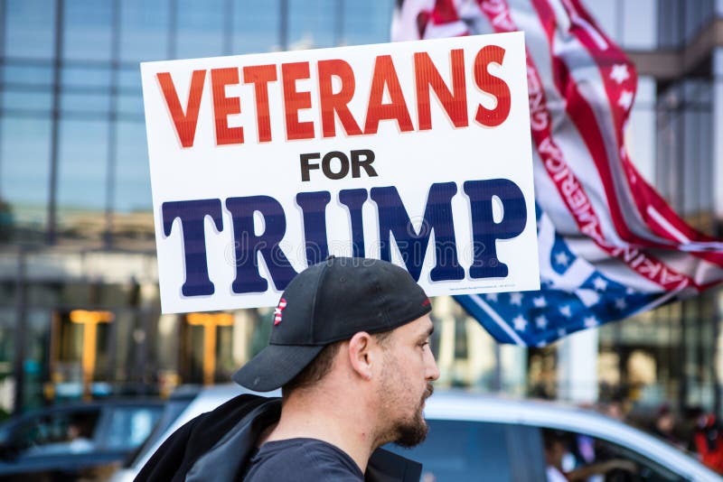 A man holds a Veterans for Trump sign at a Stop the Steal rally.  Rally attendees insist that the 2020 election was won by Biden through widespread voter fraud. Columbus, Ohio. November 7th 2020. A man holds a Veterans for Trump sign at a Stop the Steal rally.  Rally attendees insist that the 2020 election was won by Biden through widespread voter fraud. Columbus, Ohio. November 7th 2020