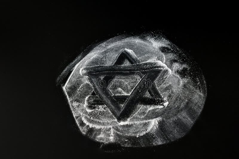 An uneven Star of David is drawn on an unknown white powder. An uneven Star of David is drawn on an unknown white powder.