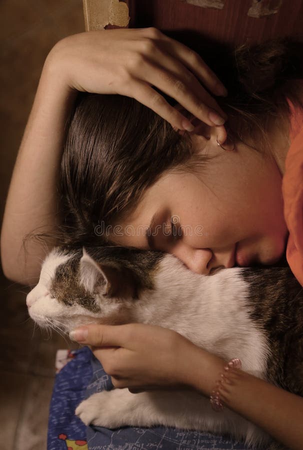 Teenager girl cuddle hug her cat pet close up photo. Teenager girl cuddle hug her cat pet close up photo