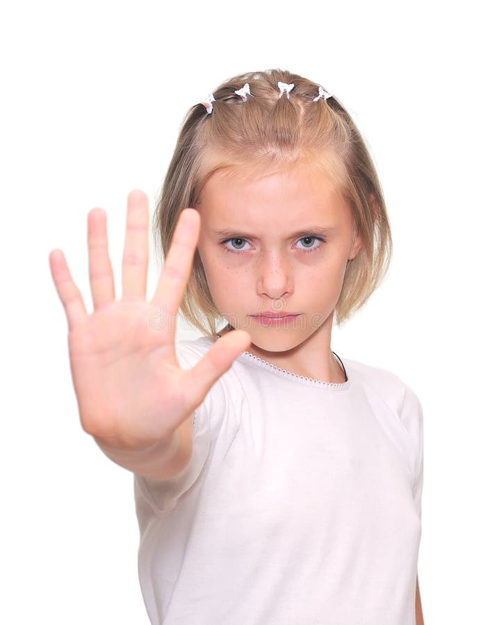 La bambina è fa un gesto di arresto fotografia stock La bambina è fa un gesto di arresto fotografia stock