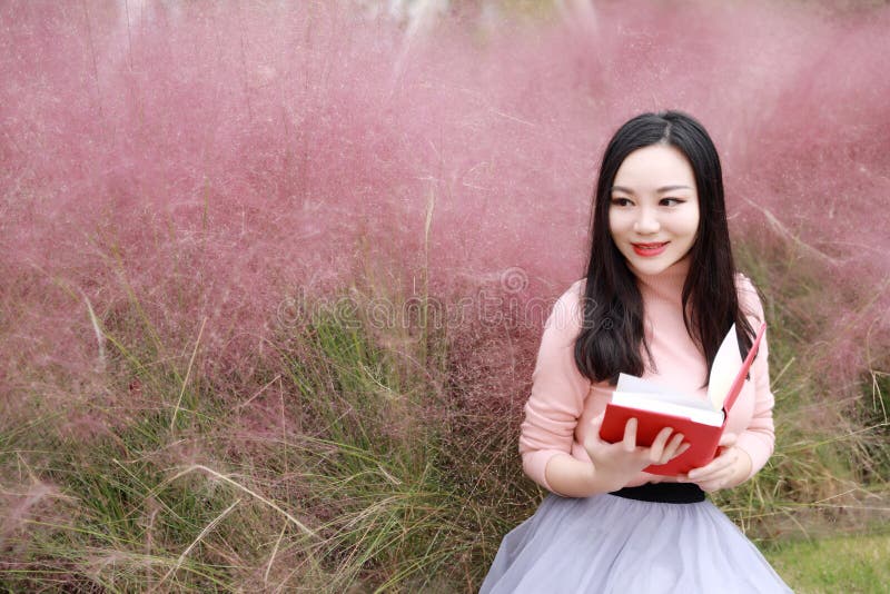 Pink colour grass lawn, rose hermosa, carnation . Pretty beautiful cute Asian Chinese woman girl reading book in a flower field outdoor in summer autumn fall park dreamlike garden. girl reads magic book.reading,summer,academic, alphabet,card,grass,homework,lawn learning letters,lying and sit on beach, outside , study in school. relaxing day. closed eyes and dream of sweet dream fairy, bible, education freedom god love learning concept. Pink colour grass lawn, rose hermosa, carnation . Pretty beautiful cute Asian Chinese woman girl reading book in a flower field outdoor in summer autumn fall park dreamlike garden. girl reads magic book.reading,summer,academic, alphabet,card,grass,homework,lawn learning letters,lying and sit on beach, outside , study in school. relaxing day. closed eyes and dream of sweet dream fairy, bible, education freedom god love learning concept