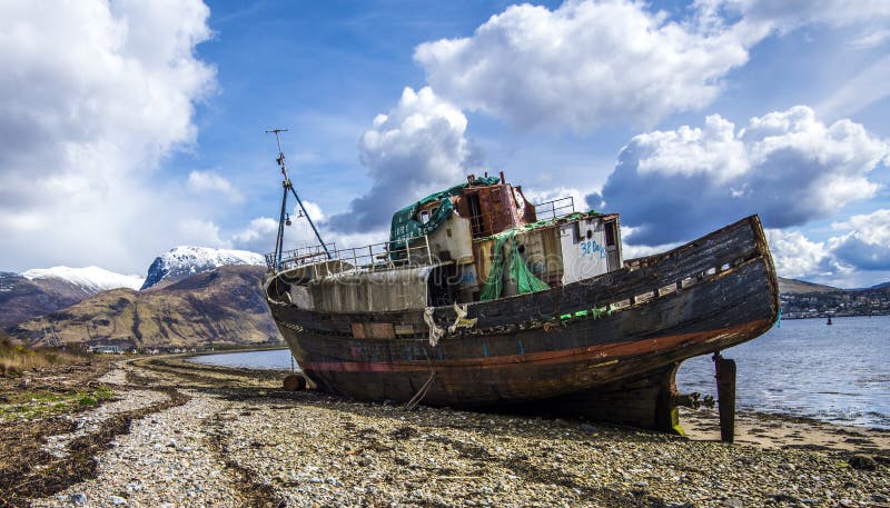 This location has wonderful views of snow-capped Ben Nevis, Britain`s highest peak. It also has a famous wreck. This herring and mackerel fishing trawler was originally launched in 1975 as the MV `Dayspring` but renamed `Golden Harvest` by new owners. Then it ran aground and was wrecked on 8th December 2011. It has recently been featured in a British Army recruitment and training advertisement on television. The body of water in the image is Loch Linnhe. This location has wonderful views of snow-capped Ben Nevis, Britain`s highest peak. It also has a famous wreck. This herring and mackerel fishing trawler was originally launched in 1975 as the MV `Dayspring` but renamed `Golden Harvest` by new owners. Then it ran aground and was wrecked on 8th December 2011. It has recently been featured in a British Army recruitment and training advertisement on television. The body of water in the image is Loch Linnhe.