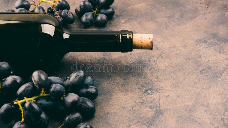 Alcohol and grapes on a metal background. Alcohol and grapes on a metal background.