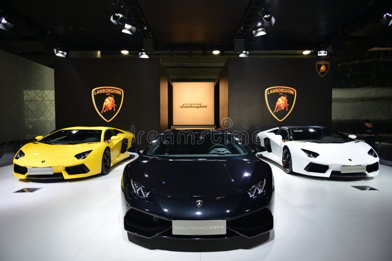 Guangzhou, China - November 22, 2014: LAMBORGHINI Aventador LP700-4 Roadster (yellow), Aventador LP700-4 Roadster (white) and Huracan LP610-4 supercars were exhibited in the 12th China (Guangzhou) International Automobile Exhibition in Guangzhou International Convention & Exhibition Center. Guangzhou, China - November 22, 2014: LAMBORGHINI Aventador LP700-4 Roadster (yellow), Aventador LP700-4 Roadster (white) and Huracan LP610-4 supercars were exhibited in the 12th China (Guangzhou) International Automobile Exhibition in Guangzhou International Convention & Exhibition Center.