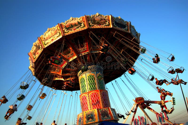 Swing ride on the midway at the Ohio State fair. Swing ride on the midway at the Ohio State fair.