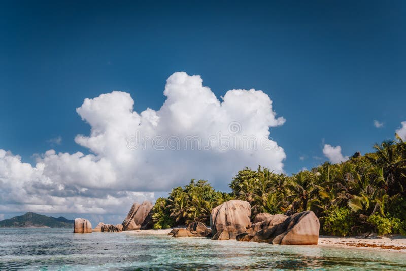 La Digue island, Seychelles, Anse Source d&#x27;Argent beach with beautiful cloudscape. Well-known island of dreams for a rest and relaxation. La Digue island, Seychelles, Anse Source d&#x27;Argent beach with beautiful cloudscape. Well-known island of dreams for a rest and relaxation.