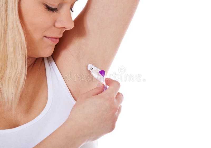 La donna rade i capelli di ascella fotografia stock libera da diritti La donna rade i capelli di ascella fotografia stock libera da diritti