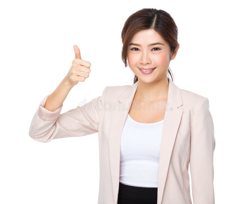 La femme asiatique de sourire d'affaires donne un pouce vers le haut de geste images stock La femme asiatique de sourire d'affaires donne un pouce vers le haut de geste images stock