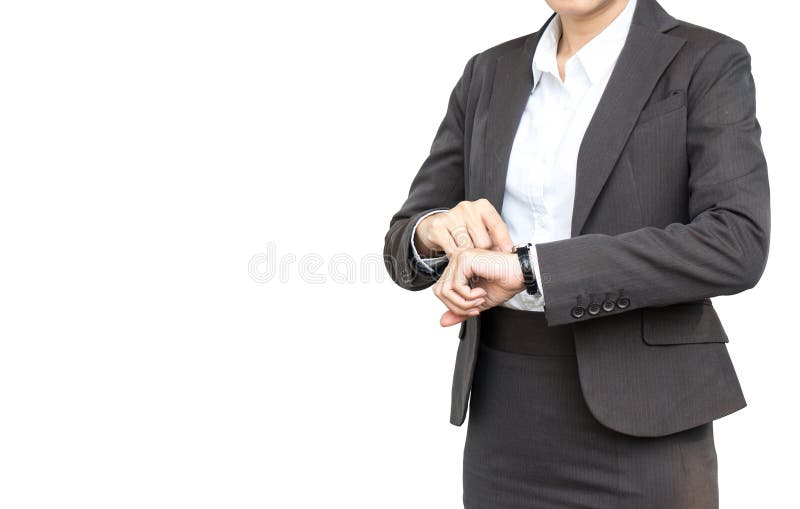 La femme d'affaires regardent sa montre sur d'isolement photographie stock libre de droits La femme d'affaires regardent sa montre sur d'isolement photographie stock libre de droits