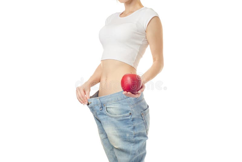 La femme perdent la pomme de centimètre de minceur de poids photographie stock libre de droits La femme perdent la pomme de centimètre de minceur de poids photographie stock libre de droits