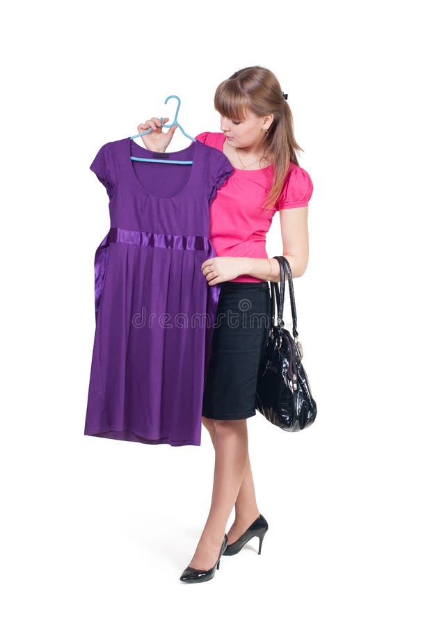 La fille achète une robe photo libre de droits La fille achète une robe photo libre de droits