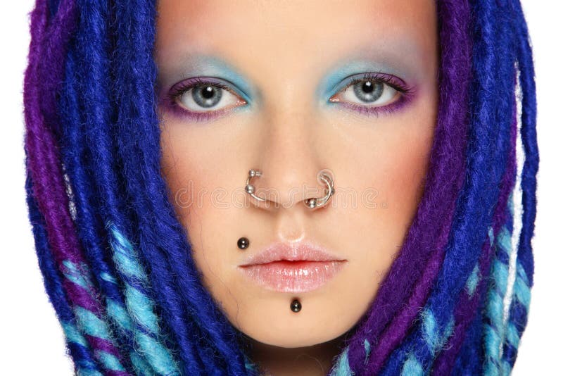 Close-up portrait of stylish freaky girl with blue dreads and beautiful make-up. Close-up portrait of stylish freaky girl with blue dreads and beautiful make-up