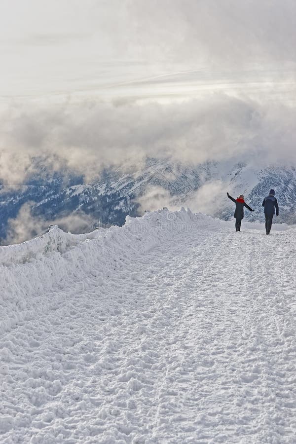 Zakopane, Poland - January 8, 2015: People taking photos in Kasprowy Wierch of Zakopane on Tatra Mountains. Kasprowy Wierch is a mountain in Zakopane and the most popular ski area in Poland. Zakopane, Poland - January 8, 2015: People taking photos in Kasprowy Wierch of Zakopane on Tatra Mountains. Kasprowy Wierch is a mountain in Zakopane and the most popular ski area in Poland