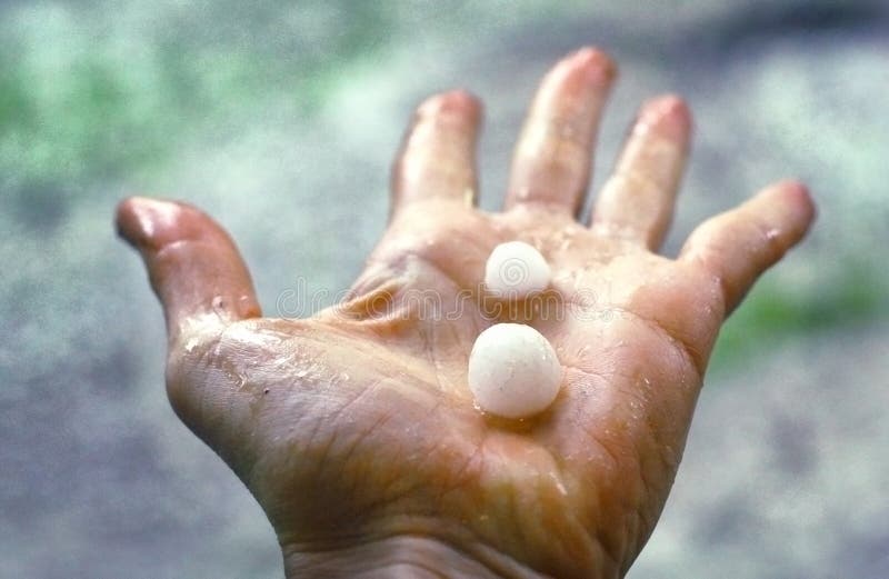 Hail lay on the human palm close up photo. Hail lay on the human palm close up photo