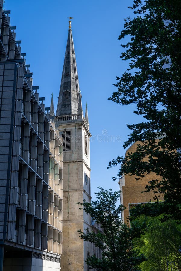 London, UK: The Guild Church of St Margaret Pattens seen from Rood Lane in the City of London. This old church has a tall spire. London, UK: The Guild Church of St Margaret Pattens seen from Rood Lane in the City of London. This old church has a tall spire.