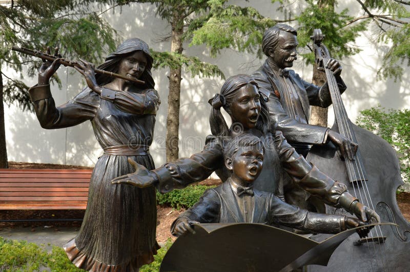 This collection of five statues includes three musicians and two singing children in the Alpenrose Park . Artist: George Lundeen. This collection of five statues includes three musicians and two singing children in the Alpenrose Park . Artist: George Lundeen