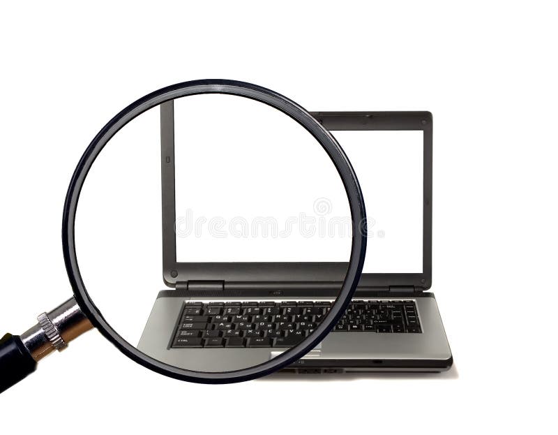La lente d'ingrandimento ingrandice il computer portatile immagini stock La lente d'ingrandimento ingrandice il computer portatile immagini stock