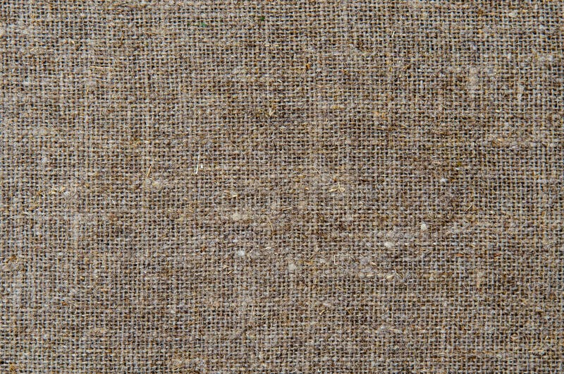 La lona de lino poner crema del paño del fondo de la textura foto de archivo La lona de lino poner crema del paño del fondo de la textura foto de archivo