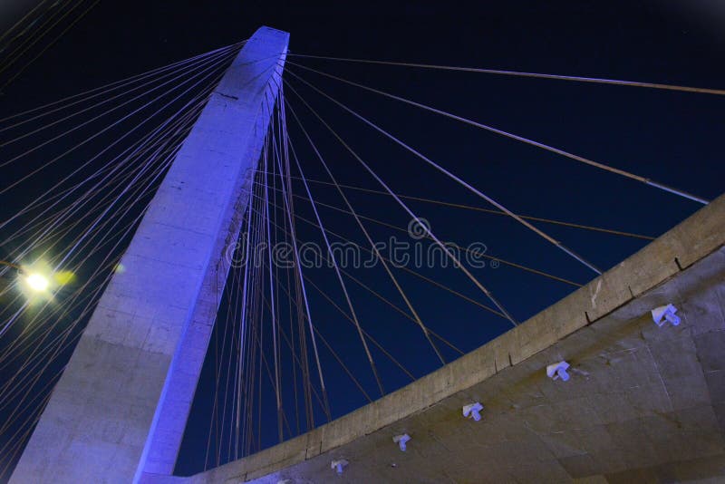 S�o Jos� dos Campos, April 5, 2024: The blue light of the Juana Blanco arch of innovation cable-stayed bridge on a busy night. S�o Jos� dos Campos, April 5, 2024: The blue light of the Juana Blanco arch of innovation cable-stayed bridge on a busy night