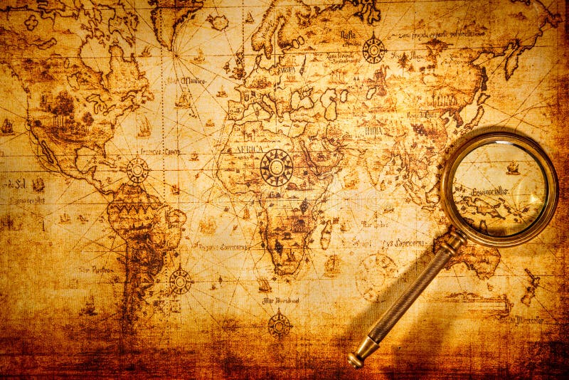 La lupa del vintage miente en un mapa del mundo antiguo fotos de archivo libres de regalías La lupa del vintage miente en un mapa del mundo antiguo fotos de archivo libres de regalías