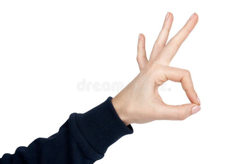 La main femelle montre le geste et le signe CORRECTS D'isolement sur le fond blanc Pull bleu-foncé image libre de droits La main femelle montre le geste et le signe CORRECTS D'isolement sur le fond blanc Pull bleu-foncé image libre de droits
