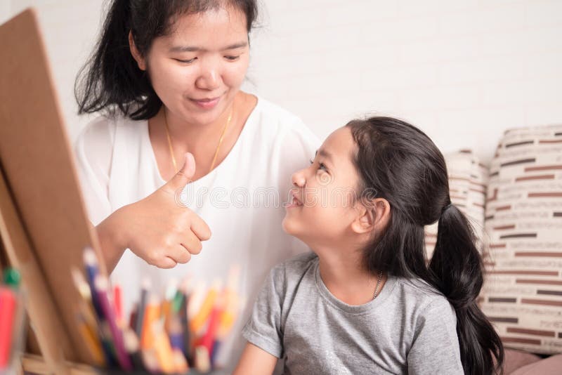 Mom gave a great thumbs-up to her daughter. Children smiling with happiness, mother, young, happy, family, fun, cheerful, parent, school, people, female, girl, senior, joy, together, smile, woman, face, home, little, cute, care, kid, success, love, support, person, lifestyle, looking, hand, finger, joyful, content, education, emotions, dough, emotional, like, learn, asian, togetherness, preschool, learning, play. Mom gave a great thumbs-up to her daughter. Children smiling with happiness, mother, young, happy, family, fun, cheerful, parent, school, people, female, girl, senior, joy, together, smile, woman, face, home, little, cute, care, kid, success, love, support, person, lifestyle, looking, hand, finger, joyful, content, education, emotions, dough, emotional, like, learn, asian, togetherness, preschool, learning, play