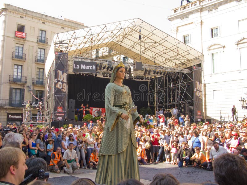 La Mercè, patron saint of Barcelona The origins of the Annual Festival After Pope Pius IX declared the Virgin of La Mercè the patron saint of the city, Barcelona began to celebrate a festival in the month of September. La Mercè really took off in 1902, when under the impulse of Francesc Cambó, the festival became the model the those that are currently held all over Catalonia. However, the history of La Mercè would suffer many high and low points that extended throughout the Civil War and the years of Franco. With the arrival of democracy, La Mercè became a truly popular celebration thanks to the participation of organisations from all over the city. Today it is a festival held in a large number of public places with a programme centred on Mediterranean culture. In less than a week Barcelona brings together a huge programme of events which forces you to choose between them: street arts, street processions, concerts, traditional dances. Week processions stock images, royalty-free photos and pictures