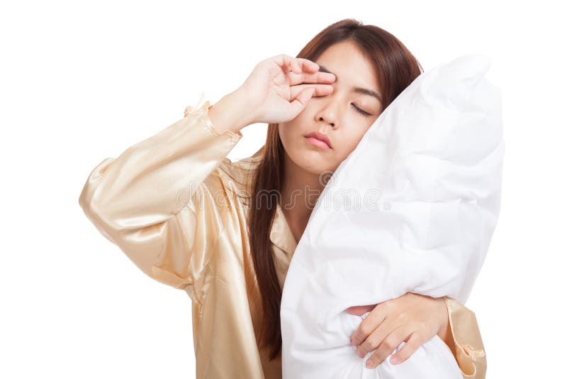 Asian girl wake up sleepy and drowsy with pillow isolated on white background. Asian girl wake up sleepy and drowsy with pillow isolated on white background