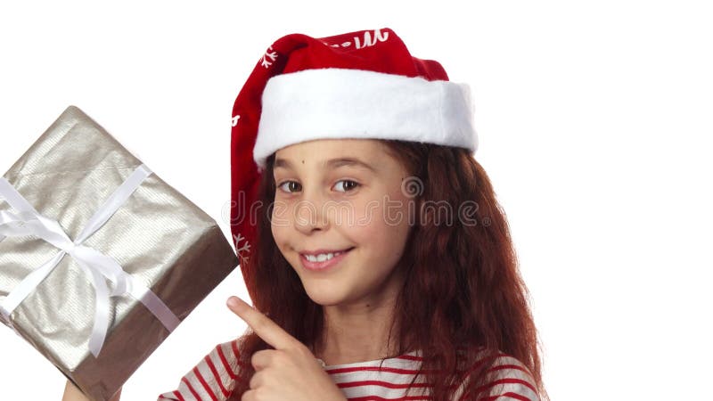 La muchacha feliz muestra su finger en su regalo y cabecea su cabeza imagenes de archivo La muchacha feliz muestra su finger en su regalo y cabecea su cabeza imagenes de archivo