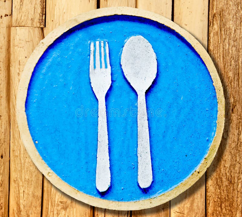 La muestra de la fork y de la cuchara foto de archivo La muestra de la fork y de la cuchara foto de archivo