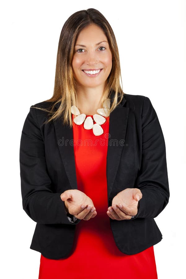 La mujer de negocios lleva a cabo hacia fuera las manos abiertas, sonriendo Concepto de la ayuda y de la ayuda imagen de archivo libre de regalías La mujer de negocios lleva a cabo hacia fuera las manos abiertas, sonriendo Concepto de la ayuda y de la ayuda imagen de archivo libre de regalías