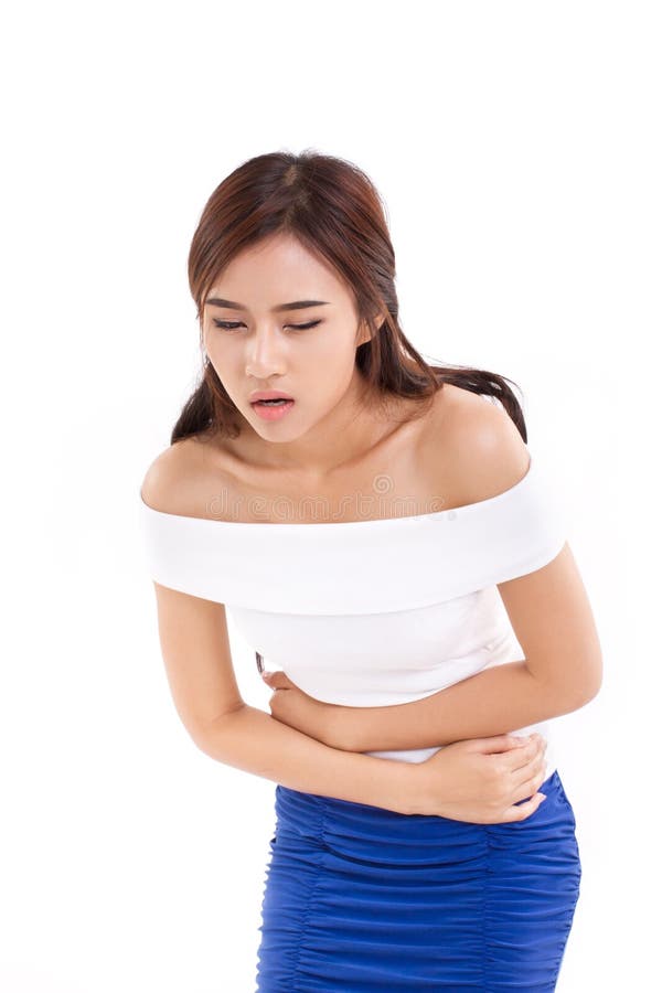 La mujer sufre de dolor de la menstruación o de dolor de estómago fotografía de archivo La mujer sufre de dolor de la menstruación o de dolor de estómago fotografía de archivo