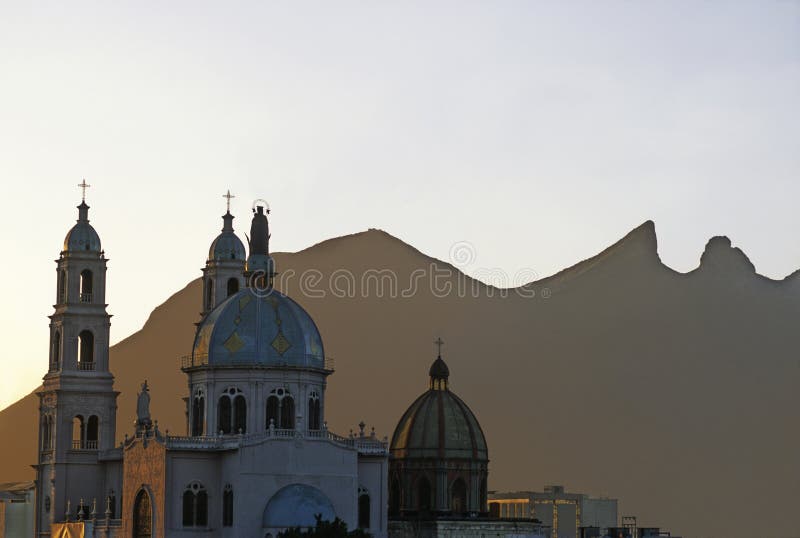 Church of Our Lady of Perpetual Help, in the background the horse saddle mountain (cerro de la silla) at the city of Monterrey, Mexico. Church of Our Lady of Perpetual Help, in the background the horse saddle mountain (cerro de la silla) at the city of Monterrey, Mexico
