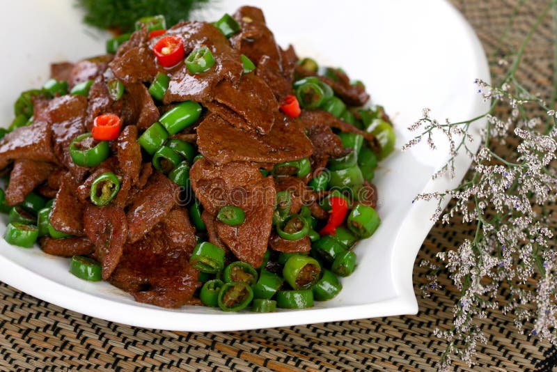 Delicious Chinese food fried dish - hot pork liver with beautiful background in studio. Delicious Chinese food fried dish - hot pork liver with beautiful background in studio