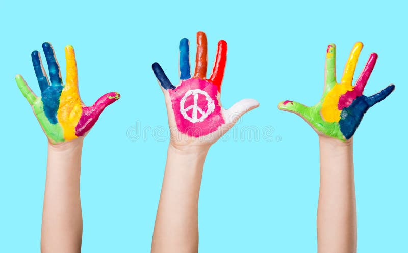 Painted peace sign in girl's hand against war. Painted peace sign in girl's hand against war.