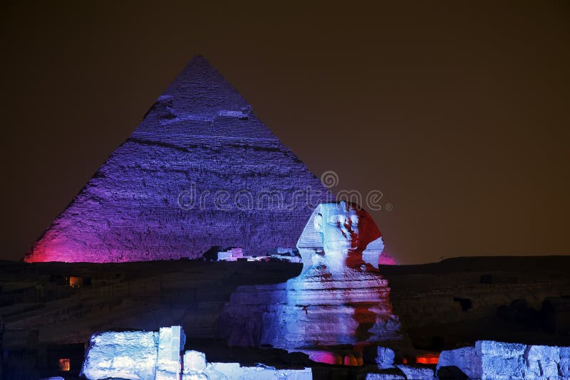 Giza pyramid and Sphinx light up for magical sound and light show. Cairo, Egypt. Giza pyramid and Sphinx light up for magical sound and light show. Cairo, Egypt.