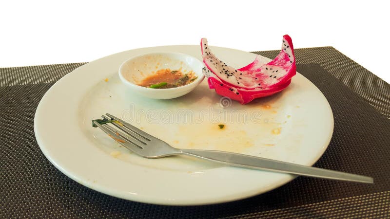 La placa blanca con los pedazos de la comida puso la tabla en blanco imagenes de archivo La placa blanca con los pedazos de la comida puso la tabla en blanco imagenes de archivo