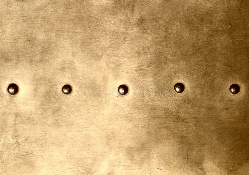 La placa de metal del marrón del oro del Grunge clava textura del fondo de los tornillos fotos de archivo libres de regalías La placa de metal del marrón del oro del Grunge clava textura del fondo de los tornillos fotos de archivo libres de regalías