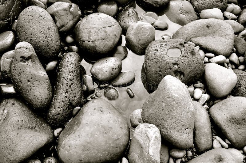 This is a picture of the rocks forming the black sand beach on Maui, Hawaii. This is a picture of the rocks forming the black sand beach on Maui, Hawaii.