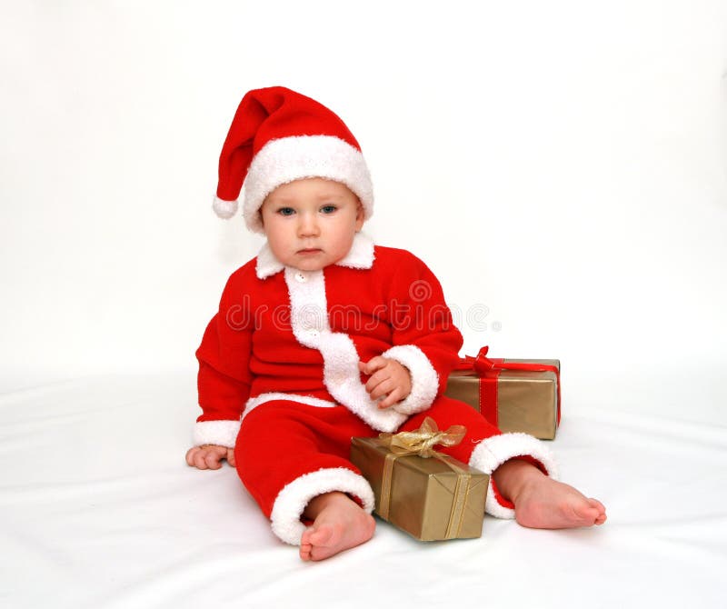 La primera Navidad del pequeño â de Papá Noel fotografía de archivo La primera Navidad del pequeño â de Papá Noel fotografía de archivo