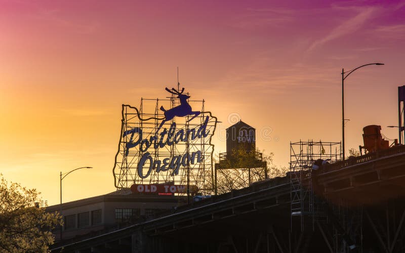 Portland, Oregon, USA - April 24, 2018 : Sunset over the iconic Portland, Oregon Old Town sign in downtown Portland, Oregon. Portland, Oregon, USA - April 24, 2018 : Sunset over the iconic Portland, Oregon Old Town sign in downtown Portland, Oregon