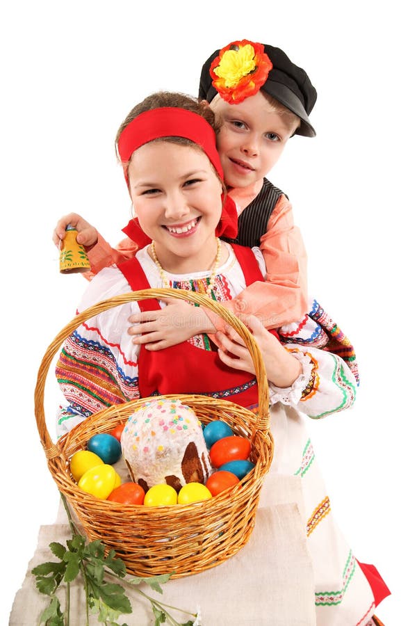 La ragazza ed il ragazzo con le uova di Pasqua E una festa agglutinano immagine stock libera da diritti La ragazza ed il ragazzo con le uova di Pasqua E una festa agglutinano immagine stock libera da diritti
