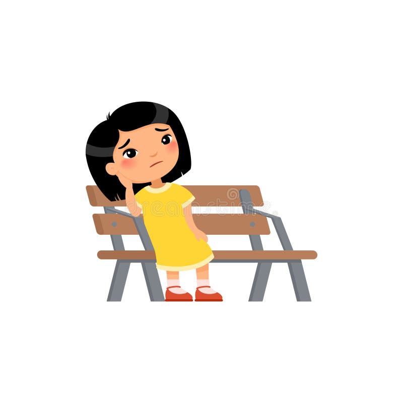 La ragazza solitaria è annoiata nel parco giochi. piccola e triste ragazza asiatica.