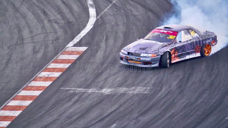 Russia Ryazan International Track Atron September 2020. A sports car in a controlled skid on the track. Smoke billows from under the wheels. Russia Ryazan International Track Atron September 2020. A sports car in a controlled skid on the track. Smoke billows from under the wheels