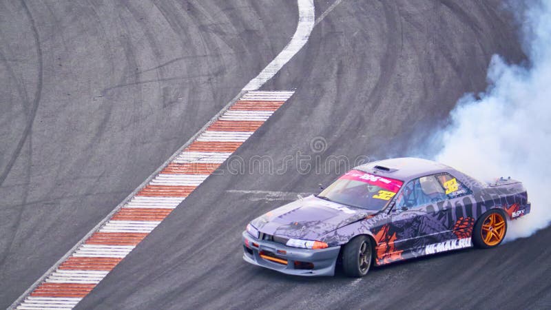 Russia Ryazan International Track Atron September 2020. A sports car in a controlled skid on the track. Smoke billows from under the wheels. Russia Ryazan International Track Atron September 2020. A sports car in a controlled skid on the track. Smoke billows from under the wheels