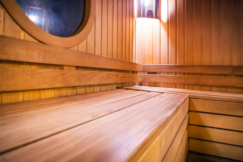 Wooden russian bathhouse sauna benches in hospital recreational room, relaxing leisure in bath-house equipment, Finnish hot steam concept. Wooden russian bathhouse sauna benches in hospital recreational room, relaxing leisure in bath-house equipment, Finnish hot steam concept